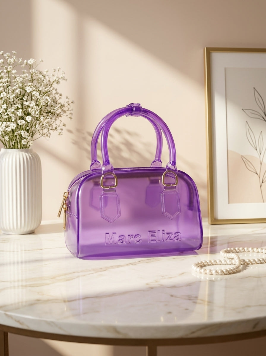 Purple jelly barrel handbag with top handles, zip closure, and Marc Eliza logo.